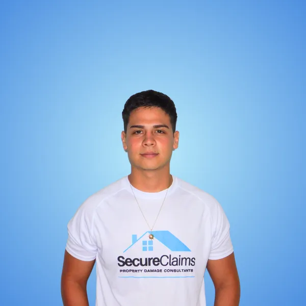 Jeremy Suarez, founder of Secure Claims Group, in a branded shirt